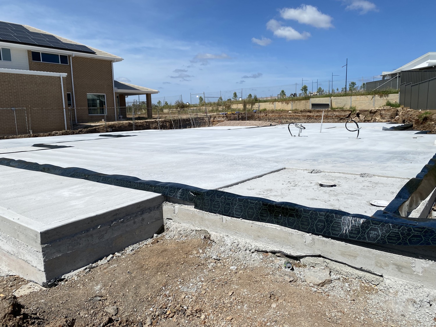 Slab edge termite barrier installation