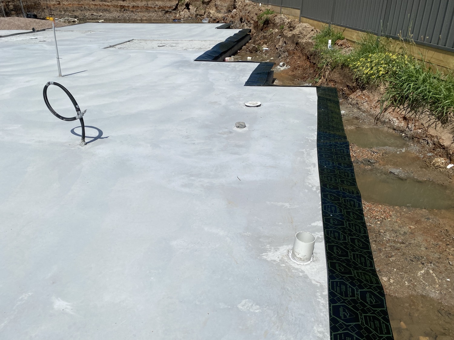 Termite barrier membrane around a slab edge